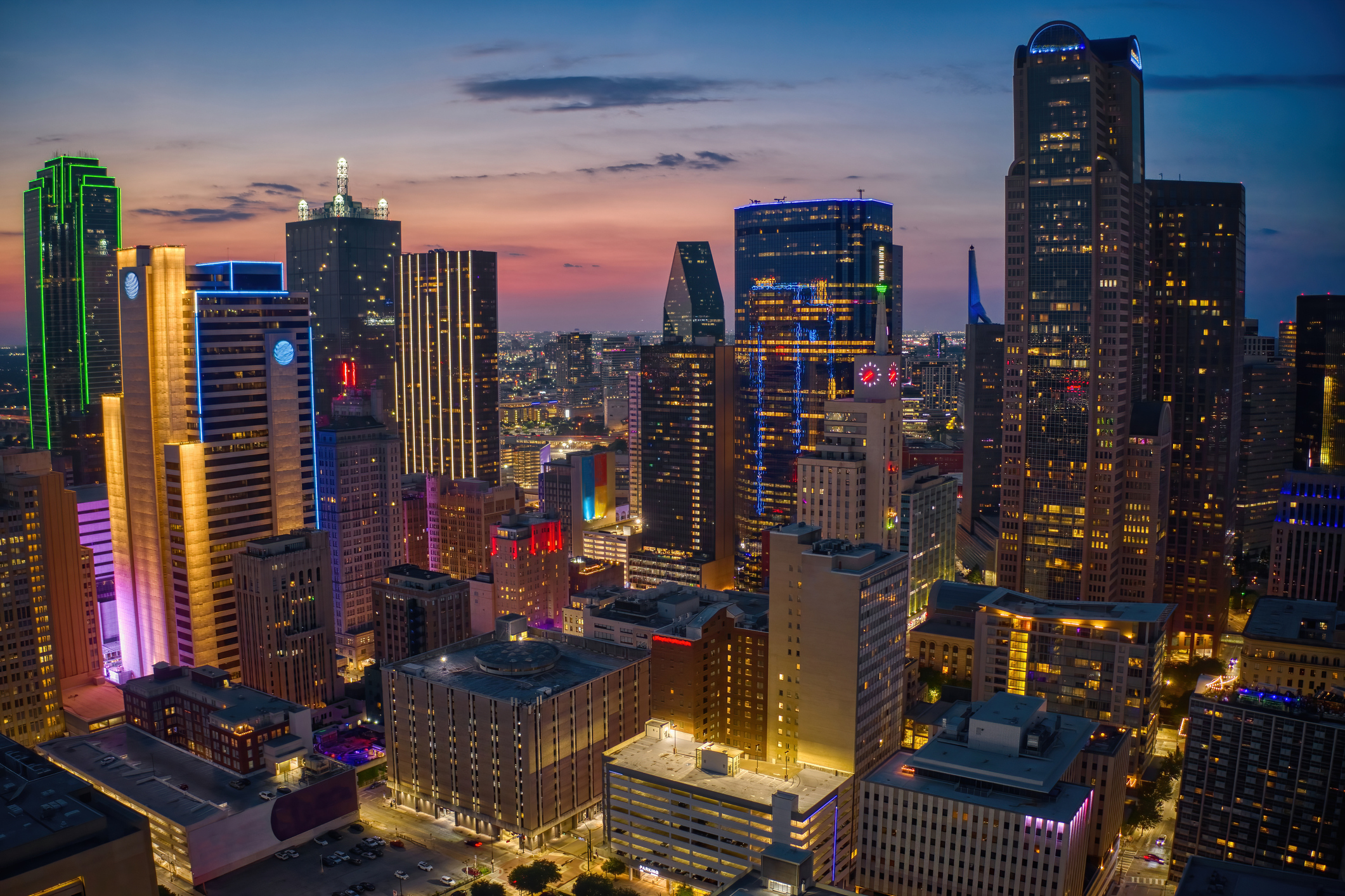 Contact Us Dallas - Aerial View of the Dallas, Texas Skyline illuminated at Night