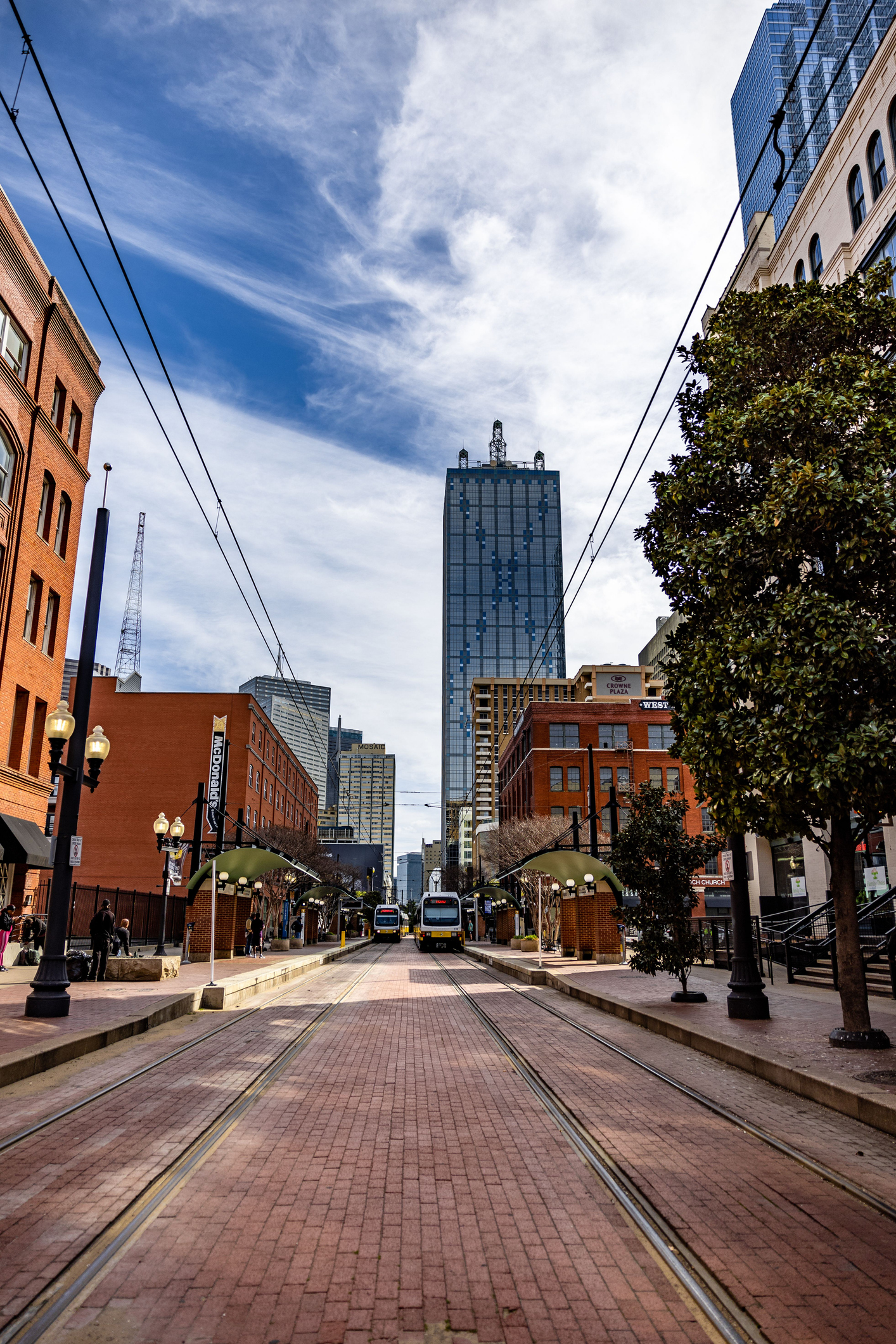 The view of Renaissance Tower in Dallas, Texas with the West End DART station in the foreground.